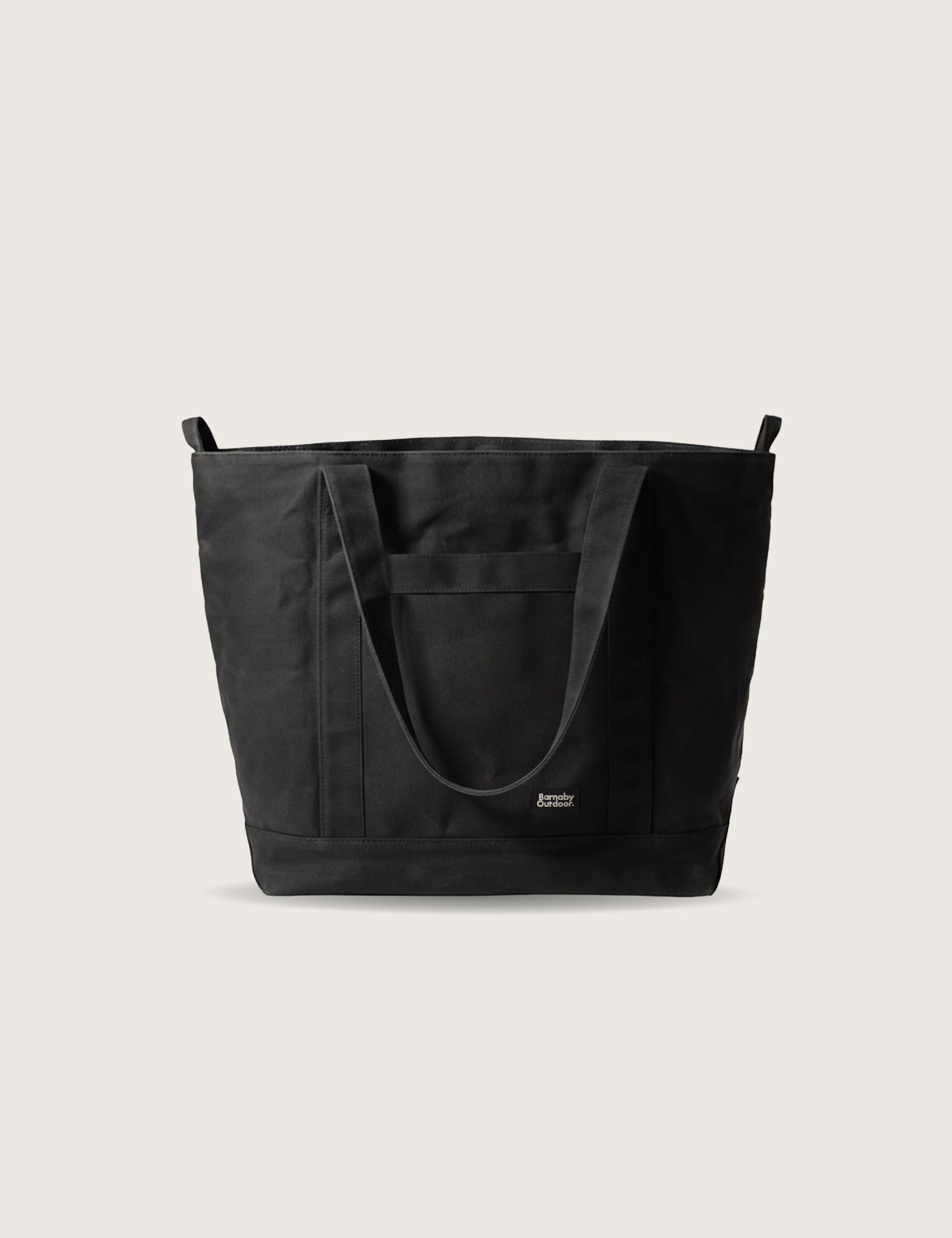 Black tote bag on a light beige background