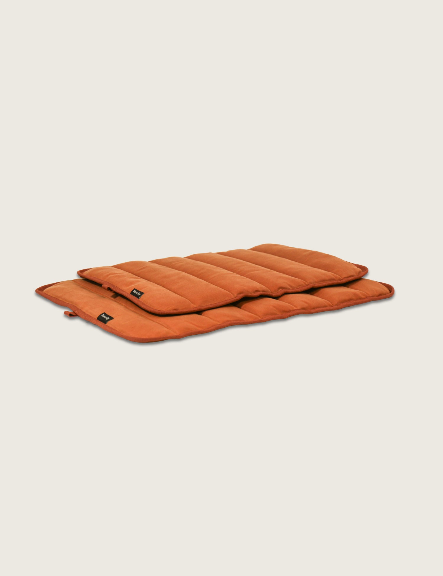Orange inflatable mat on a beige background