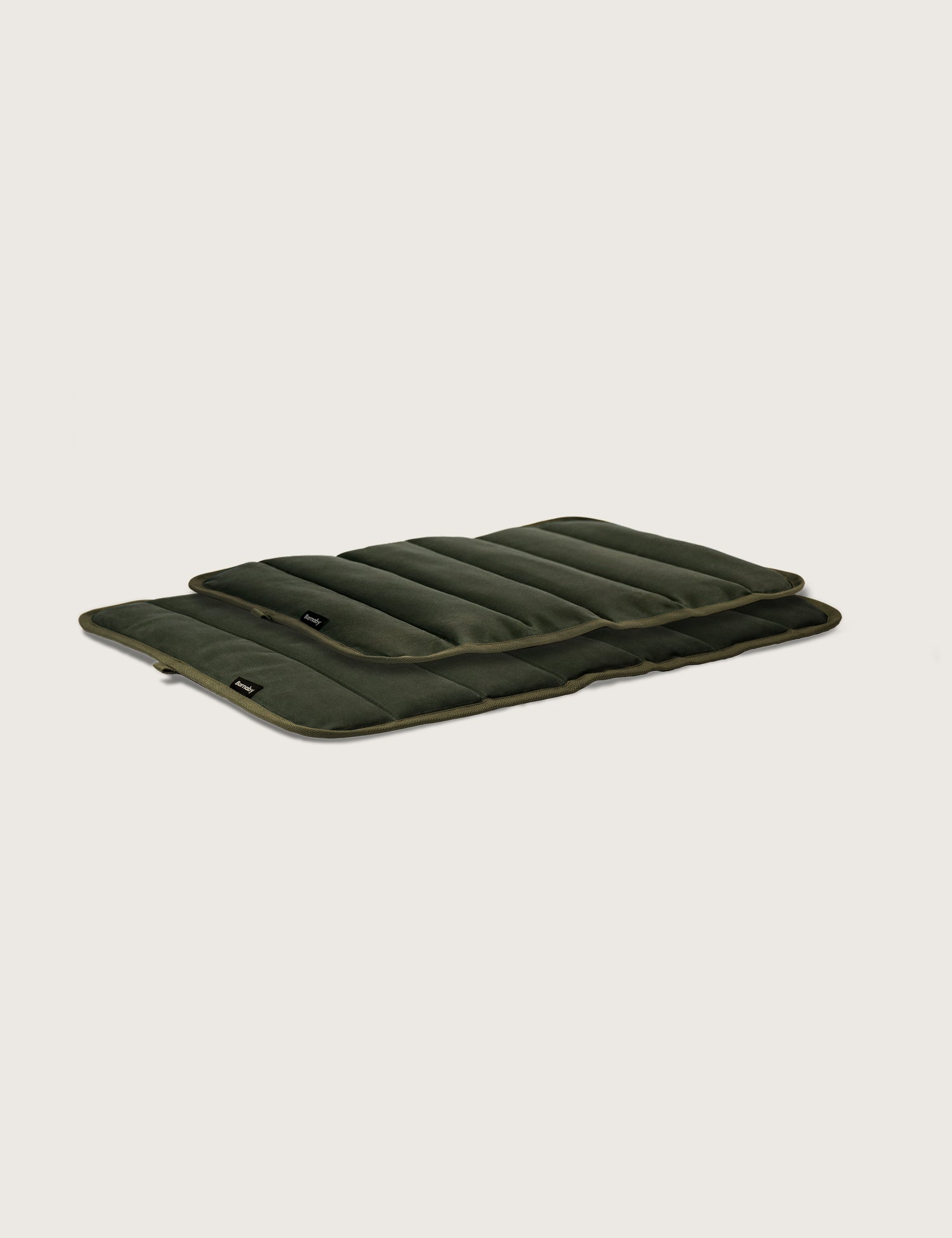 Green quilted mat on a light gray background