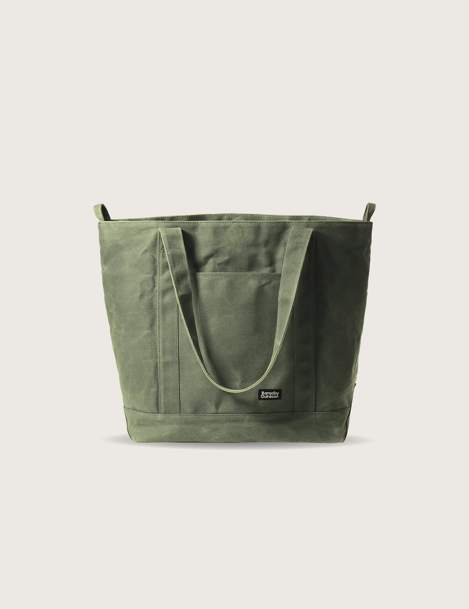 Green tote bag on a light beige background